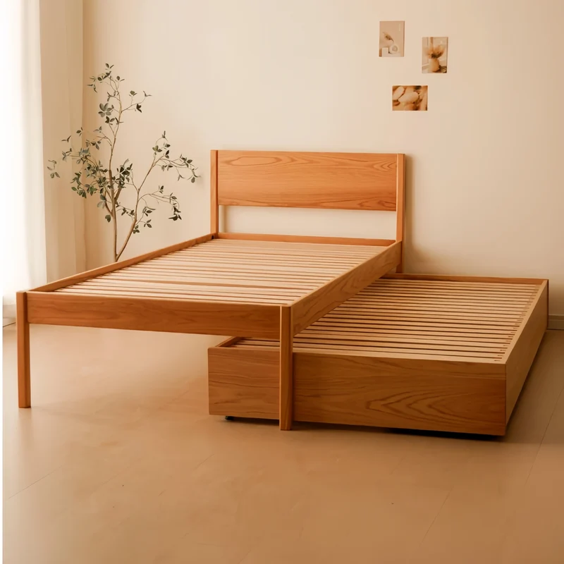 Cama plataforma de madera maciza de roble con cama nido extraíble y cajones de almacenamiento debajo.