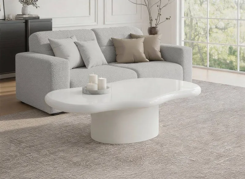 Mesa de centro ovalada ZELINE en hormigón blanco cepillado con una tapa asimétrica